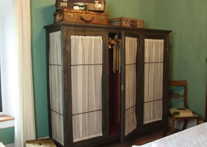 Wardrobe recovered with old suitcases