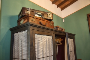 Particular original style wardrobe with vintage suitcases