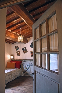 Double room with stylish furnishings and exposed beams