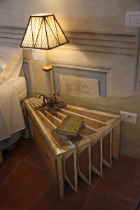 Bedside table reinterpreted with lamp in style