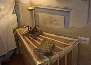 Bedside table reinterpreted with lamp in style
