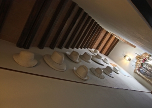 Models for hats as decoration of the stairs leading to the upper floor